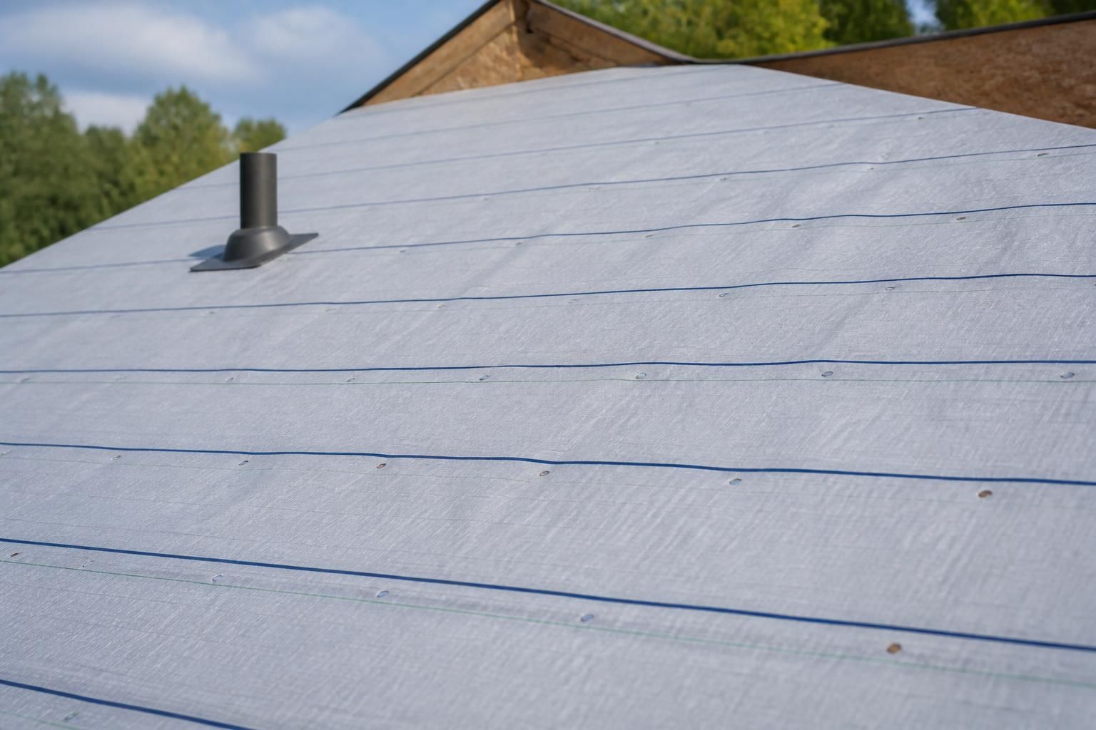Fresh underlayment installed across a roof deck.